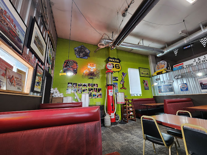 The vintage interior of The Garage Cafe with happy customers enjoying their meals